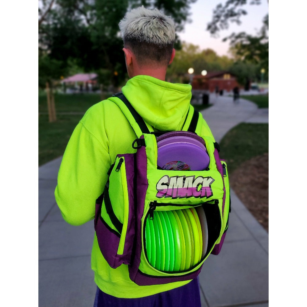 small purple and green disc golf backpack