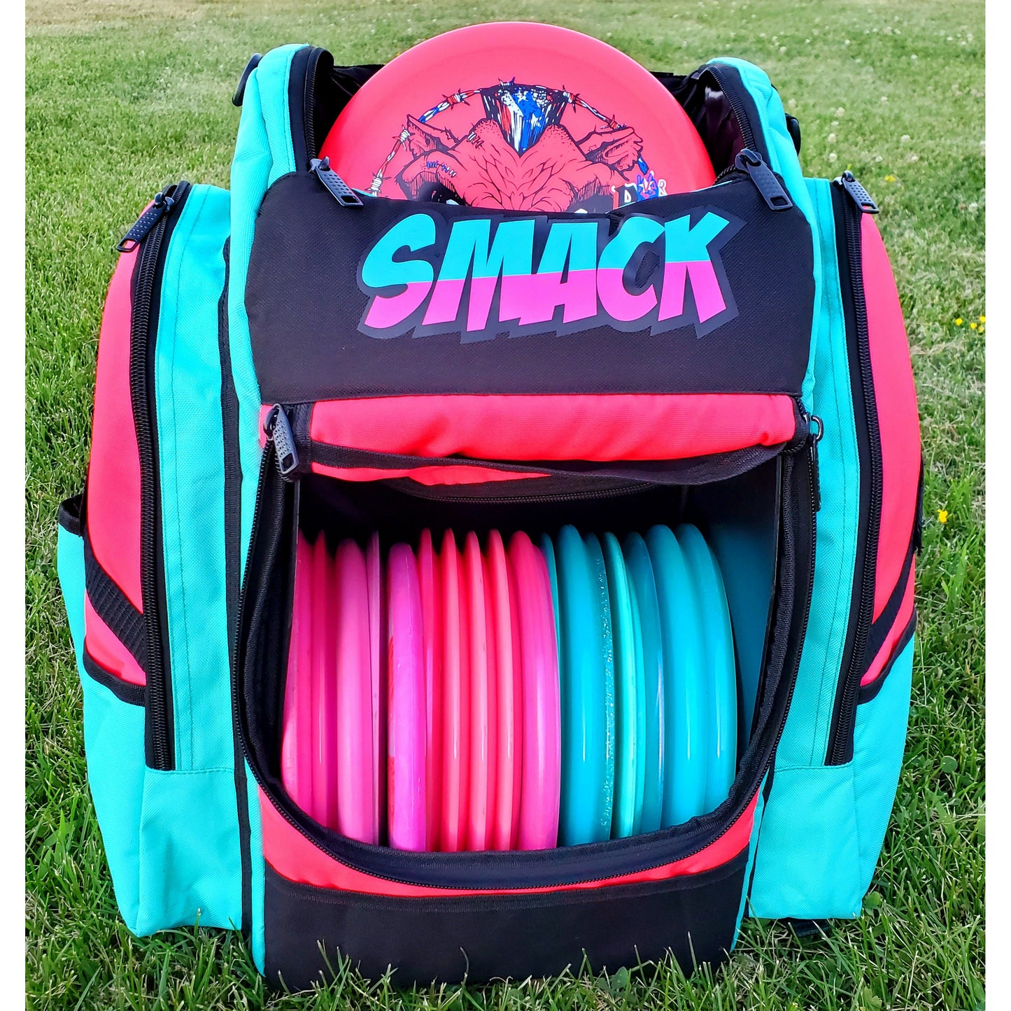 Pink and teal disc golf backpack