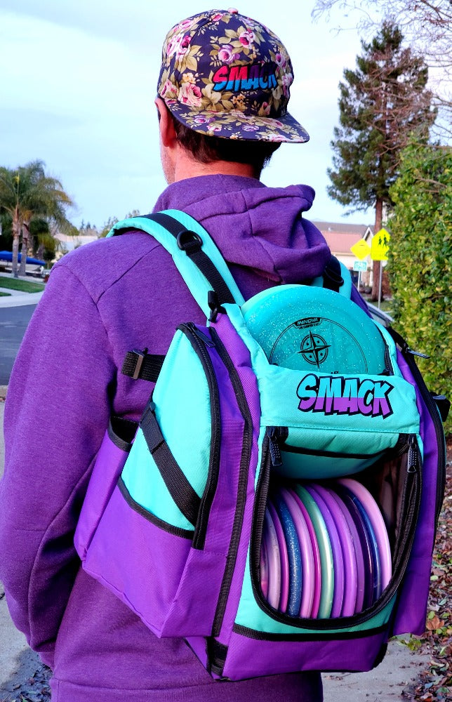 purple and teal disc golf backpack