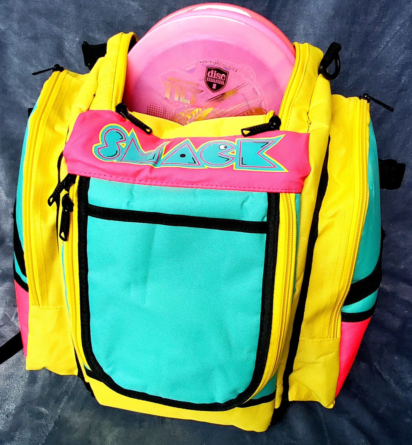 pink and teal disc golf bag